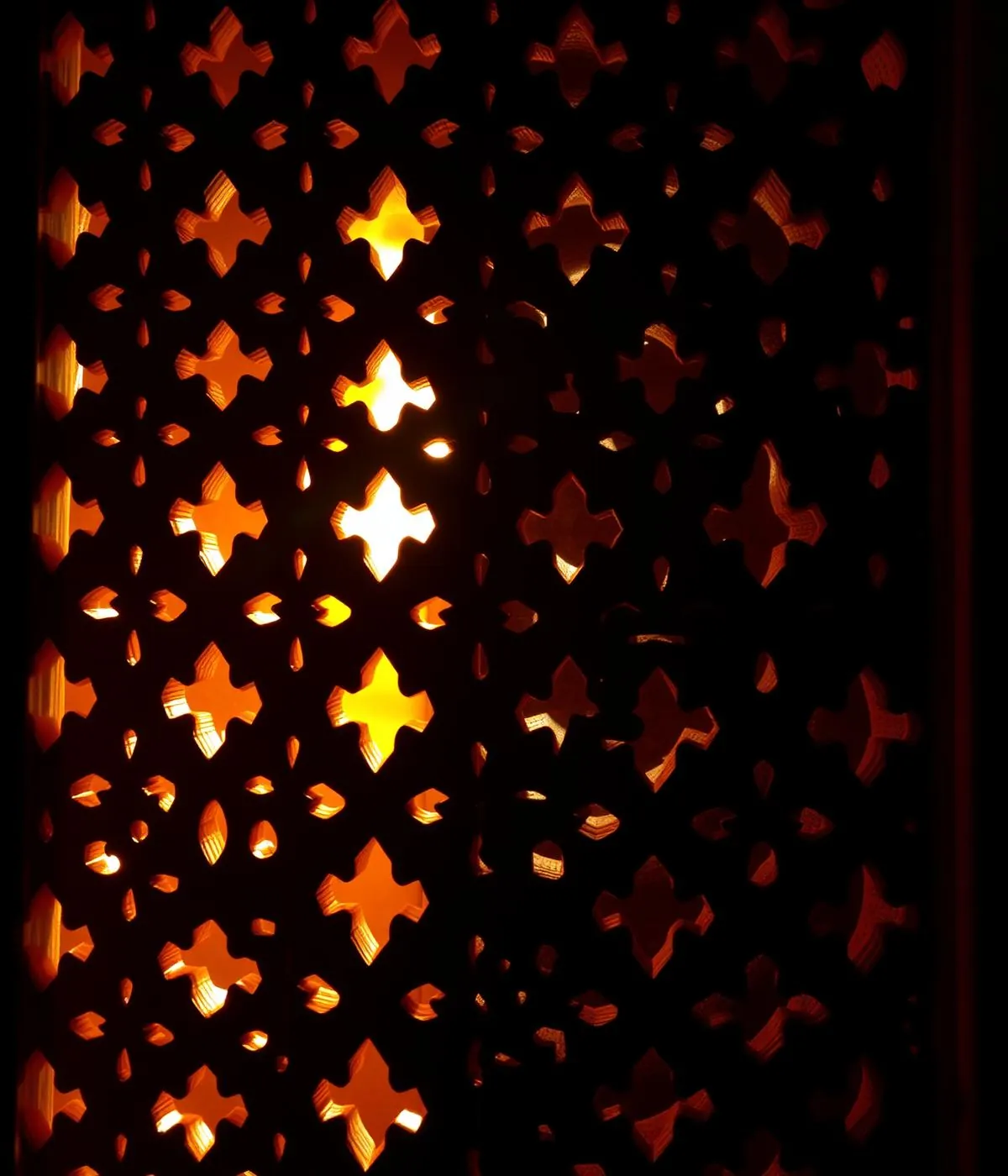 Brass lantern and patterned screen detail